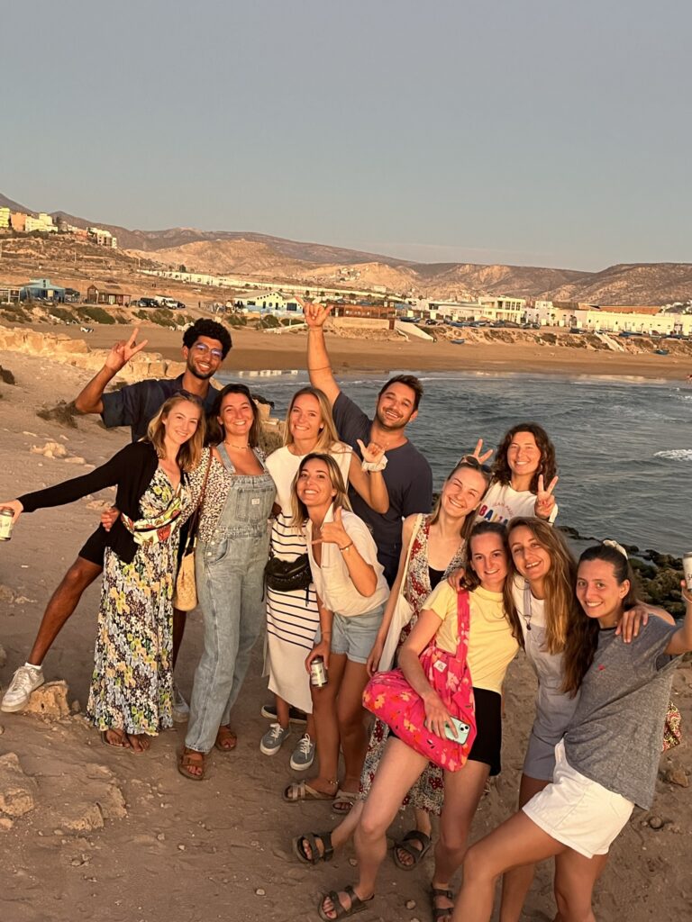 Group of surfers and yogis at Devil's Rock, Morocco