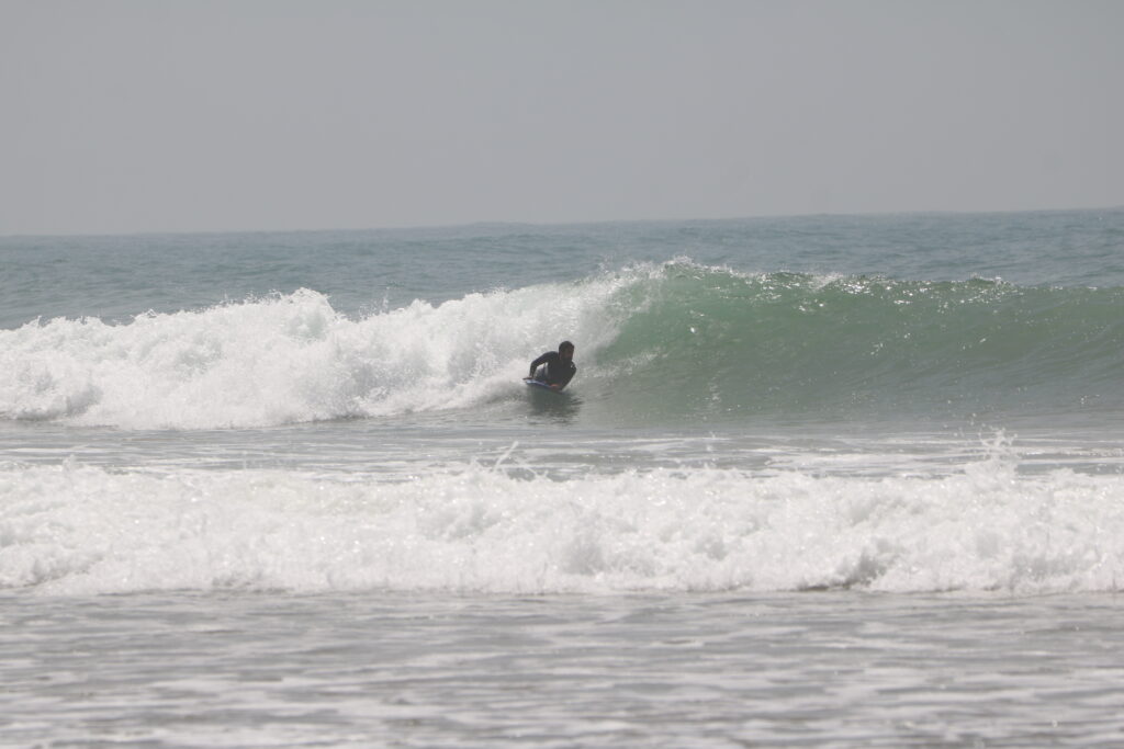 A bodyboarder catching a wave at Anza, near Agadir, Morocco.